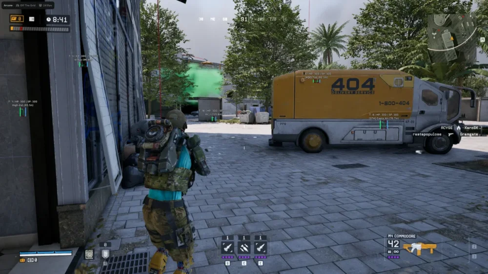 A soldier in camo and tactical gear walks on a cobblestone path, approaching a yellow van labeled "404" amidst trees and buildings in a video game setting.
